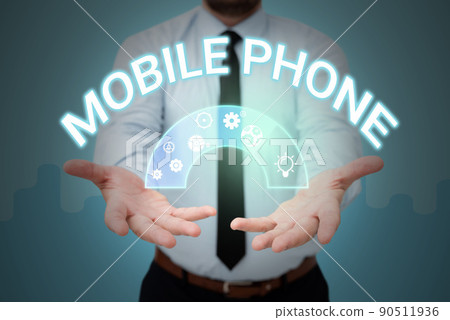 Handwriting text Mobile Phone. Business overview A handheld device used to send receive calls and messages Businessman in suit holding open palms represents innovative thinking. 90511936