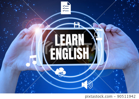 Text sign showing Learn English. Business concept Universal Language Easy Communication and Understand Hands holding tablet presenting innovative ideas symbolizing technology. 90511942