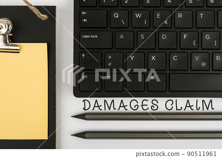 Hand writing sign Damages Claim. Concept meaning Demand Compensation Litigate Insurance File Suit Computer Keyboard And Symbol.Information Medium For Communication. 90511961
