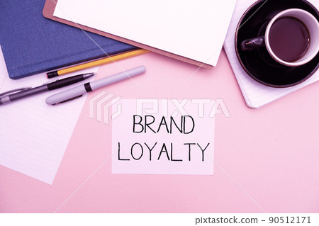 Text caption presenting Brand Loyalty. Business idea Repeat Purchase Ambassador Patronage Favorite Trusted Office Supplies Over Desk With Keyboard And Glasses And Coffee Cup For Working Text caption presenting Brand Loyalty. Business idea Repeat Purchase Ambassador Patronage Favorite Trusted Office Supplies Over Desk With Keyboard And Glasses And Coffee Cup For Working 90512171