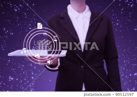 Text caption presenting Liquid Assets. Concept meaning Cash and Bank Balances Market Liquidity Deferred Stock Lady in suit holding electrical tablet presenting innovative thinking. 90512597