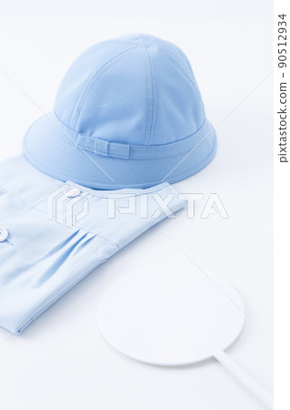 Children's clothes and white plate 90512934