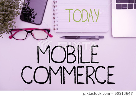 Text sign showing Mobile Commerce. Business approach Using mobile phone to conduct commercial transactions online Office Supplies Over Desk With Keyboard And Glasses And Coffee Cup For Working Text sign showing Mobile Commerce. Business approach Using mobile phone to conduct commercial transactions online Office Supplies Over Desk With Keyboard And Glasses And Coffee Cup For Working 90513647