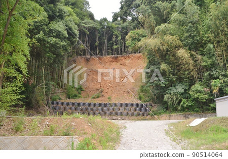 Temporary restoration status of slopes that collapsed due to torrential rain and exposed mountain surface Temporary restoration status of slopes that collapsed due to torrential rain and exposed mountain surface 90514064