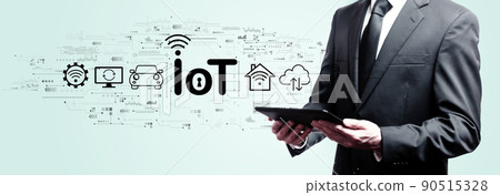 IoT theme with businessman holding a tablet IoT theme with businessman holding a tablet 90515328