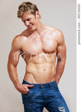 Muscles with no end. Cropped shot of a handsome young man posing in his  underwear. Stock Photo by YuriArcursPeopleimages