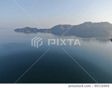 Aerial view of Nasake Island from the sky above the rain source field village at the tip of Yashiro Island Aerial view of Nasake Island from the sky above the rain source field village at the tip of Yashiro Island 90516908