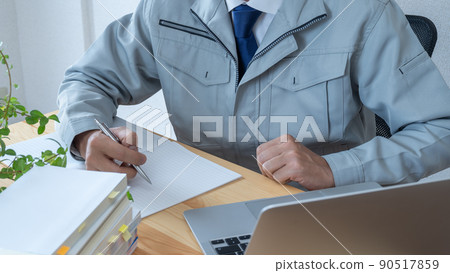 Image of a construction businessman aiming to acquire qualifications while working Image of a construction businessman aiming to acquire qualifications while working 90517859