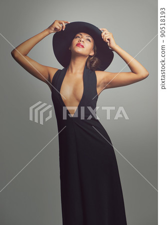 Living in sytle. Studio portrait of a stylishly dressed young woman. Living in sytle. Studio portrait of a stylishly dressed young woman. 90518193