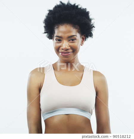 I look and feel amazing. Studio shot of an attractive young female athlete posing against a grey background. I look and feel amazing. Studio shot of an attractive young female athlete posing against a grey background. 90518212