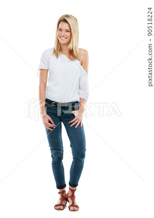 Casual style can still make a fashion statement. Studio portrait of an attractive young woman posing against a white background. 90518224