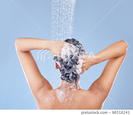 I shampoo twice and only apply conditioner once. Shot of an unrecognisable woman washing her hair. I shampoo twice and only apply conditioner once. Shot of an unrecognisable woman washing her hair. 90518241