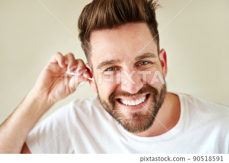 Cleanliness is next to handsomeness. Cropped shot of a handsome young man going through his morning routine in the bathroom. 90518591