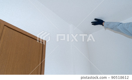 Workers inspecting wallpaper | Remodeling survey / estimate image 90518612