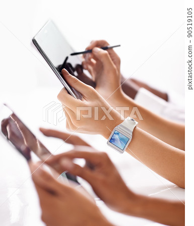 Synced with the times. A row of hands using digital devices. Synced with the times. A row of hands using digital devices. 90519105