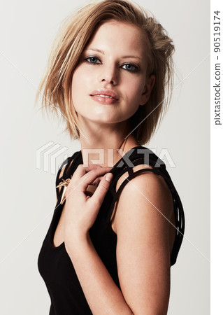 Its hard to look away. Studio shot of a young edgy fashion model. Its hard to look away. Studio shot of a young edgy fashion model. 90519174