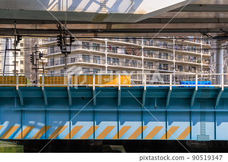 An iron bridge and a highway running over it 90519347