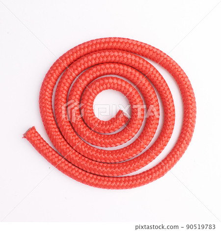 Tying things together. Studio shot of a coiled rope. 90519783