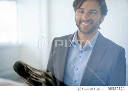 Hes young and successful. Portrait of a handsome young businessman. 90520121