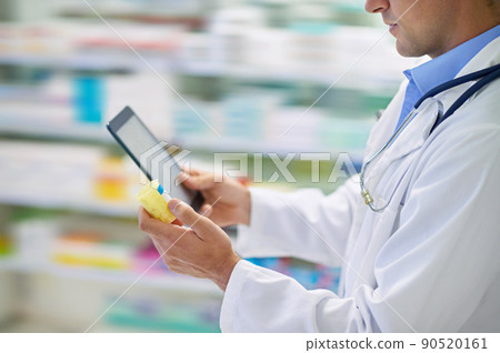 Use technology to find your way. A pharmacist working on a digital tablet. Use technology to find your way. A pharmacist working on a digital tablet. 90520161