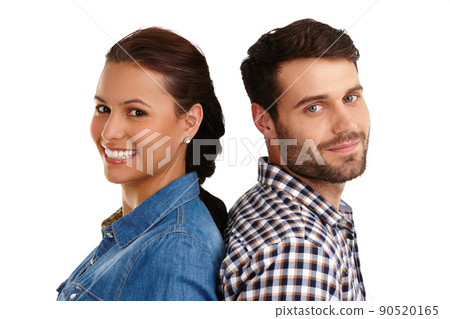 Weve got each others backs. Studio portrait of a happy young couple standing back to back isolated on whuite. Weve got each others backs. Studio portrait of a happy young couple standing back to back isolated on whuite. 90520165