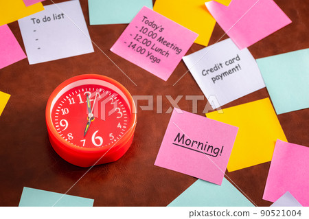 red clock among colorful note paper red clock among colorful note paper 90521004