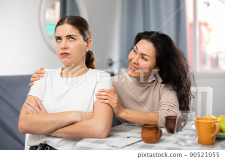 Annoyed stressed female couple sitting at home 90521055