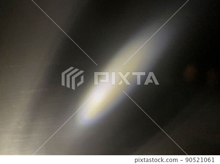 Abstract lens flare yellow light on a black background Abstract lens flare yellow light on a black background 90521061