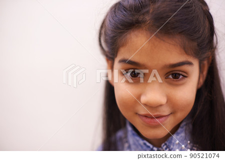 Shes a cutie. Portrait of a cute little girl smiling. Shes a cutie. Portrait of a cute little girl smiling. 90521074