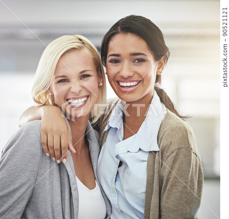 Shes the best. Cropped portrait of two businesswomen standing in the office. Shes the best. Cropped portrait of two businesswomen standing in the office. 90521121