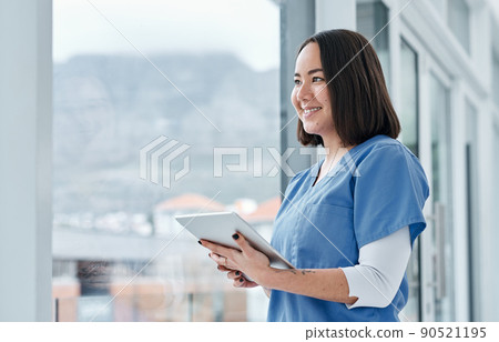 Facilitating effective data management with smart tech. Shot of a medical practitioner using a digital tablet in a hospital. 90521195