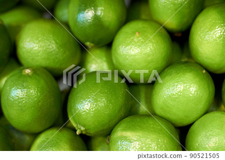 Fresh and healthy. Cropped shot of fresh and shiny limes. 90521505
