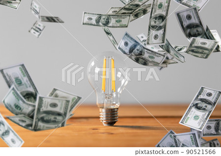 close up of light bulb on wooden table 90521566