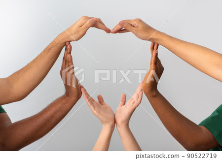 close up of hands making heart gesture close up of hands making heart gesture 90522719