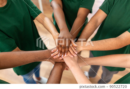 close up of volunteers stacking hands close up of volunteers stacking hands 90522720