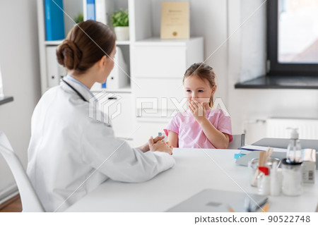 doctor and little girl patient coughing at clinic 90522748