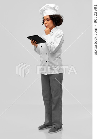 thinking female chef with tablet computer thinking female chef with tablet computer 90522991