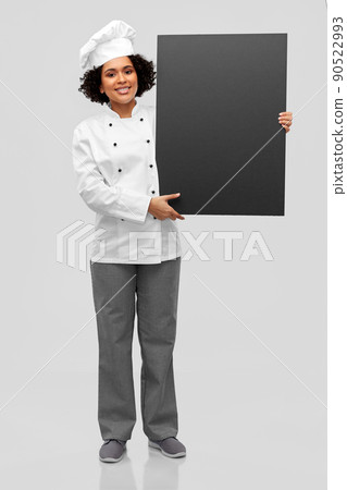 smiling female chef holding black chalkboard smiling female chef holding black chalkboard 90522993