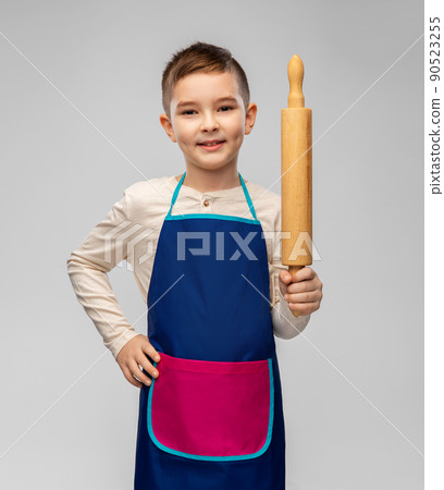 smiling little boy in apron with rolling pin smiling little boy in apron with rolling pin 90523255