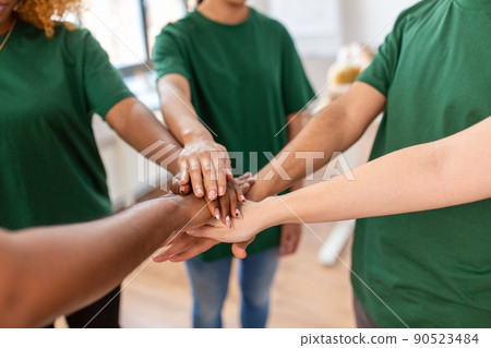 close up of volunteers stacking hands close up of volunteers stacking hands 90523484