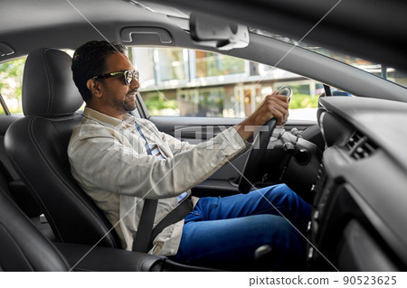 smiling indian man in sunglasses driving car smiling indian man in sunglasses driving car 90523625