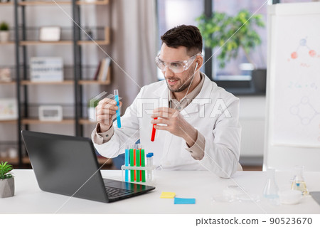 chemistry teacher with laptop having online class chemistry teacher with laptop having online class 90523670
