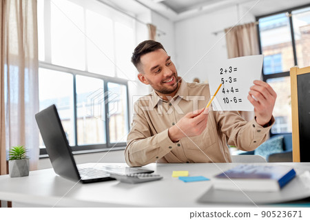 male math teacher having online class at home male math teacher having online class at home 90523671