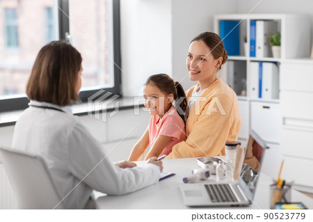 mother with little daughter and doctor at clinic 90523779