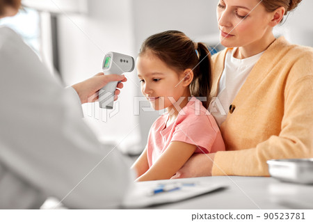 mother with sick daughter and doctor at clinic 90523781