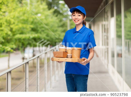 delivery woman with takeaway food in city 90523798
