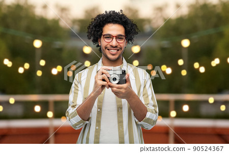 smiling man or photographer with camera at party smiling man or photographer with camera at party 90524367