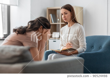 psychologist and woman at psychotherapy session psychologist and woman at psychotherapy session 90524498