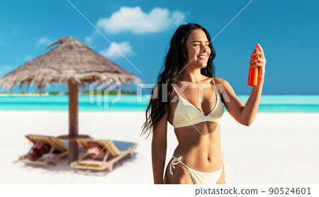 smiling woman in bikini with sunscreen on beach smiling woman in bikini with sunscreen on beach 90524601