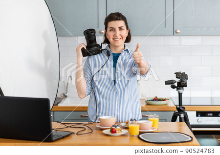 food photographer with camera working in kitchen food photographer with camera working in kitchen 90524783